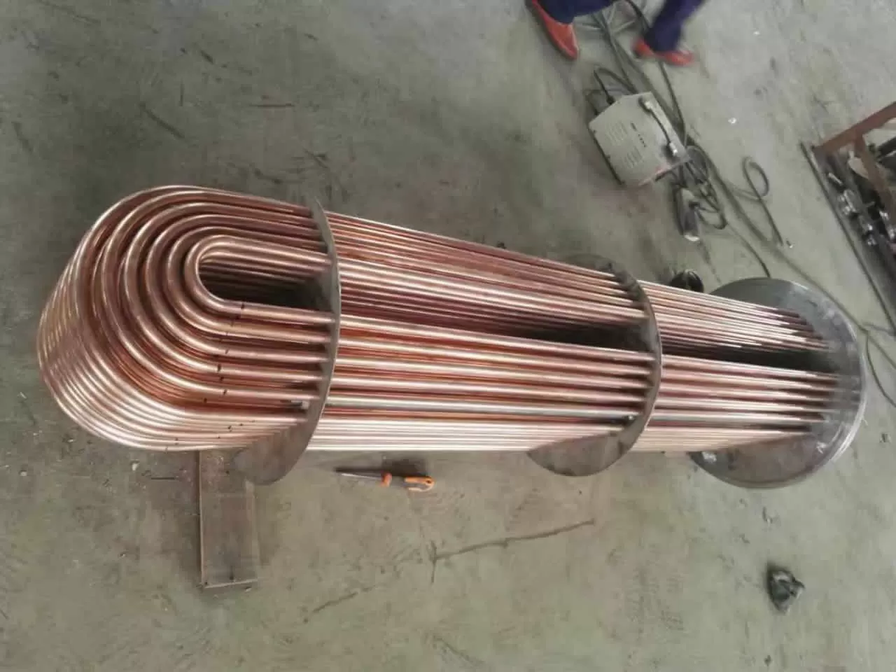 Positive displacement heat exchanger tube exchange